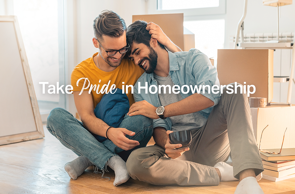A smiling gay couple in their home. Boxes in the background suggest they're recently moved in together.
