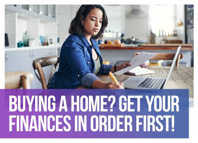 A woman using a laptop and paper to evaluate her finances.